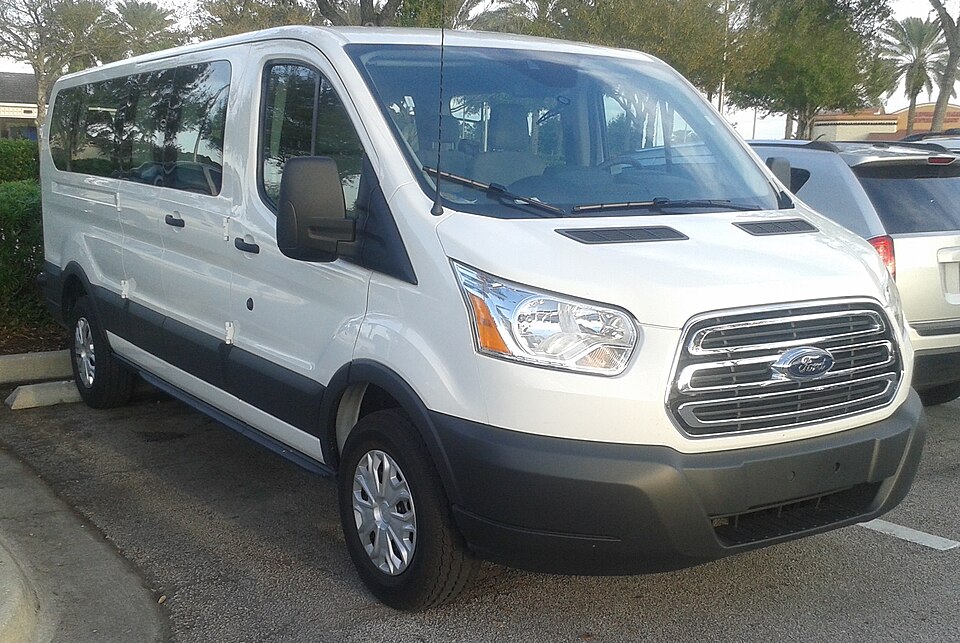 White Ford Transit passenger minibus – illustrative stock photograph